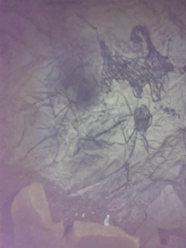 Saved camera frame: painted figures across the upper wall of a chamber.