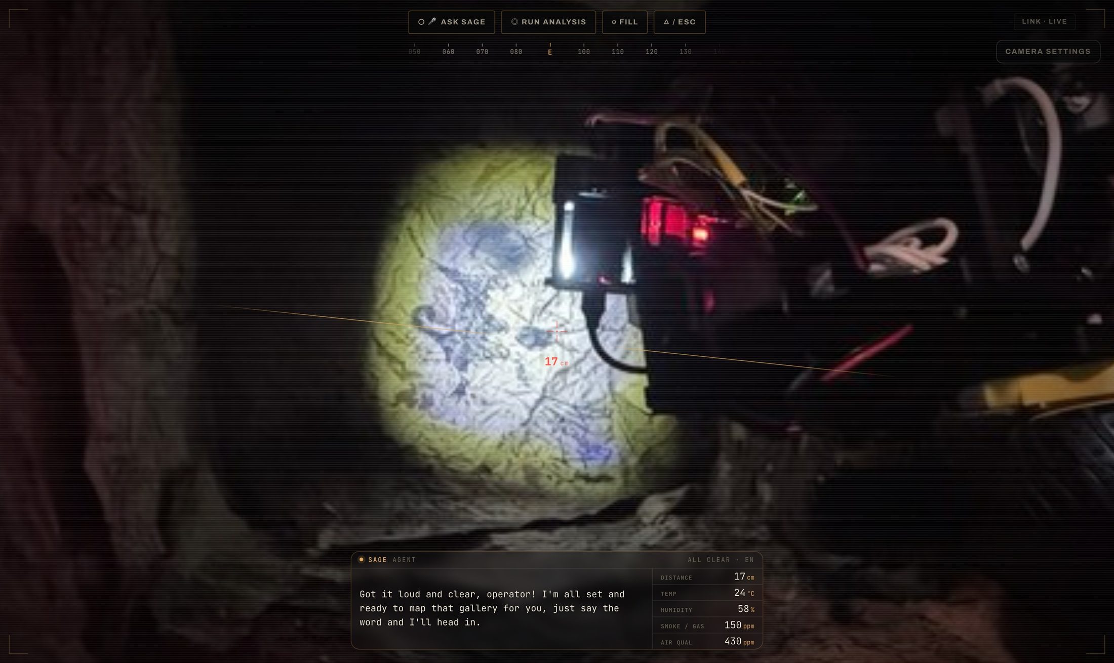 The full-screen FPV view: camera feed, heading tape, distance reticle and Sage's voice bar.